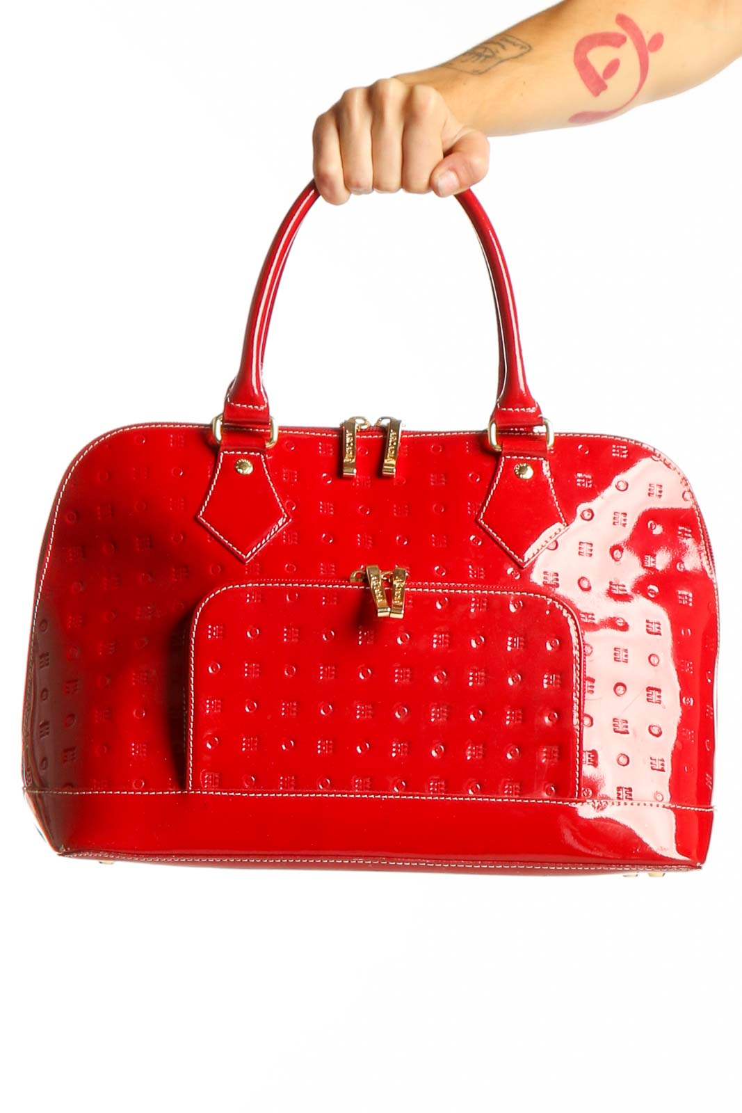 Front view of red patent leather Arcadia satchel with embossed design