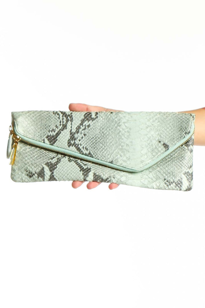 Front view of Henri Bendel mint green snakeskin envelope clutch with gold hardware