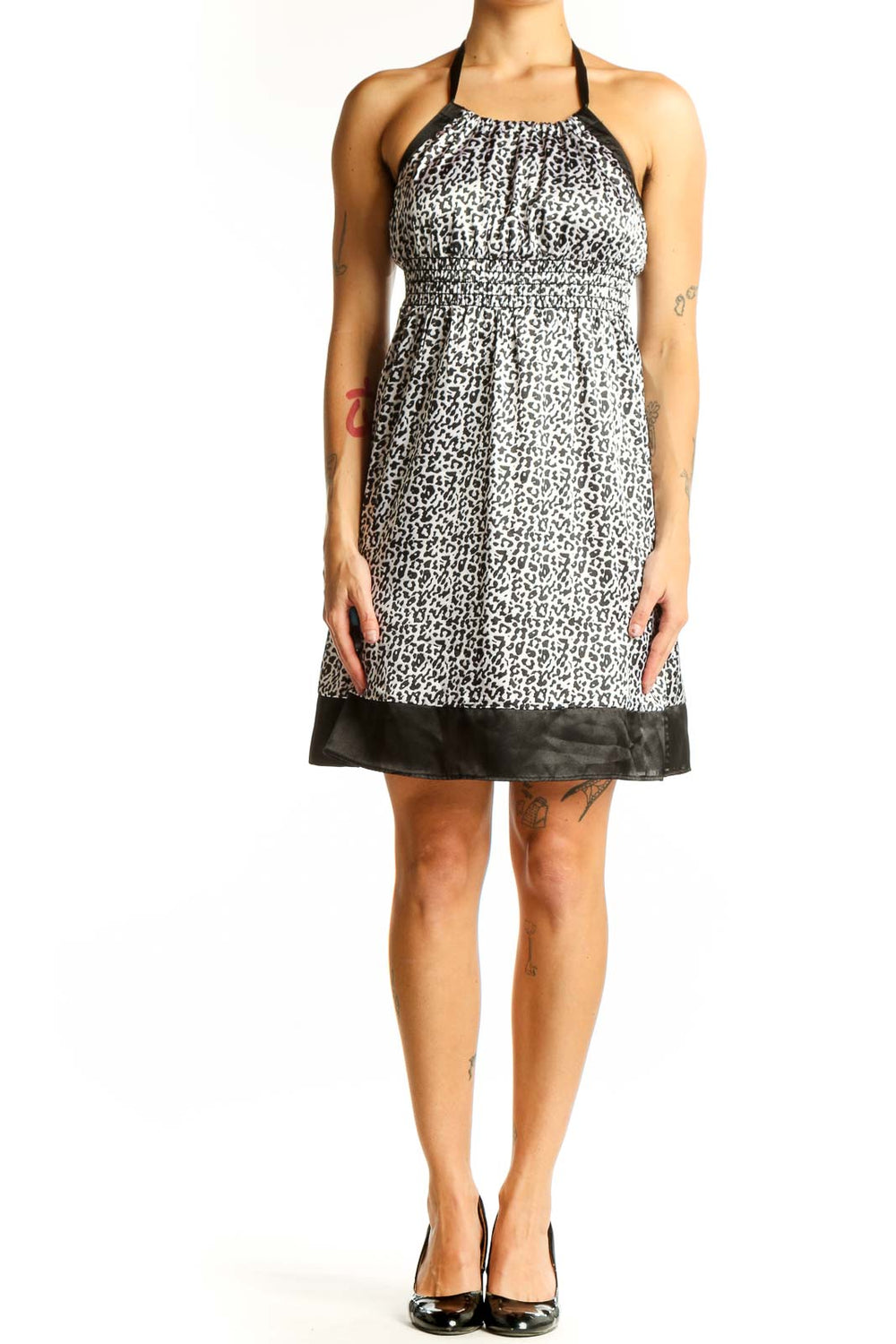 Front view of Guess Jeans black and white leopard print halter dress