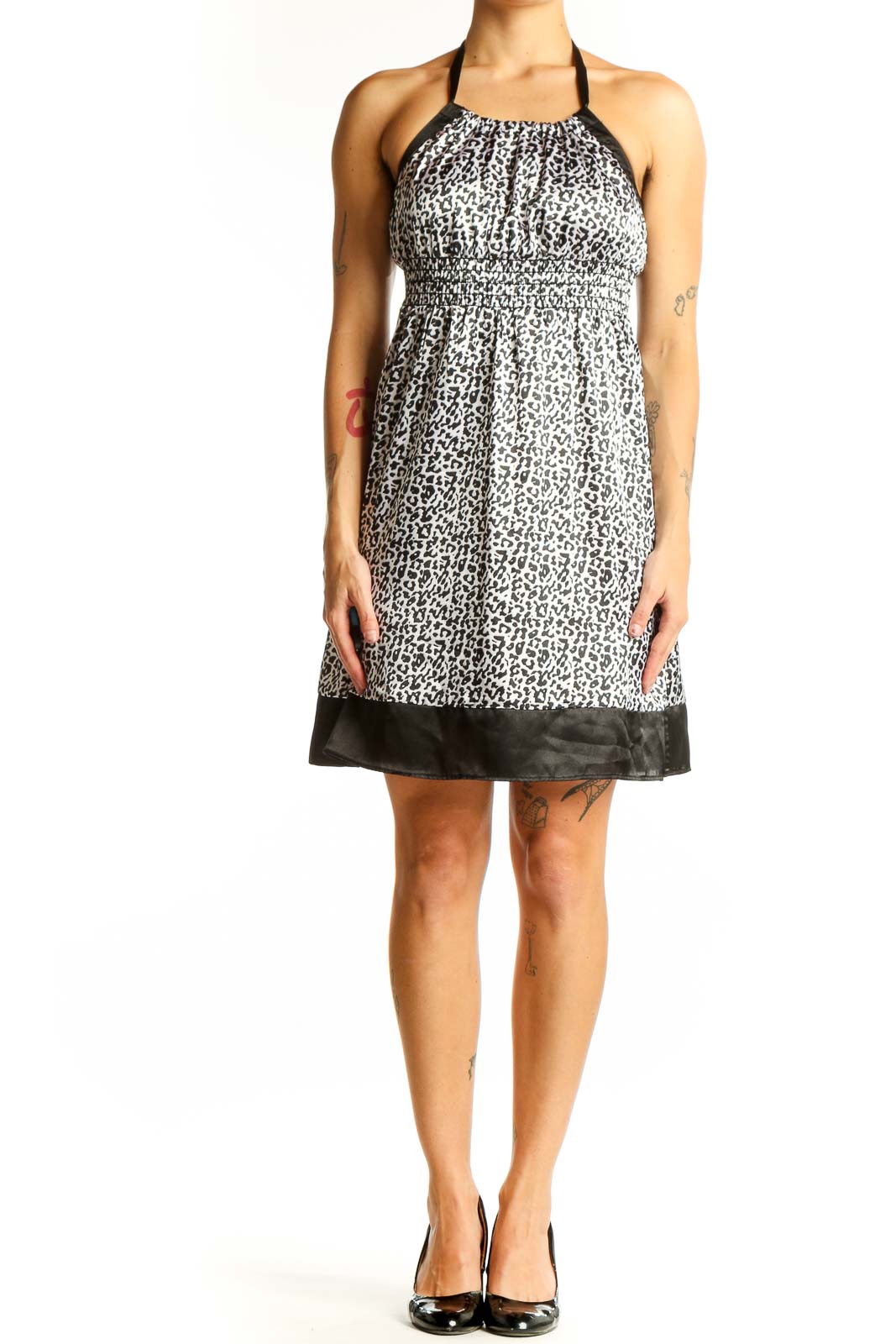 Front view of Guess Jeans black and white leopard print halter dress