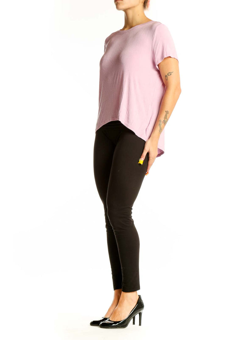 Front view of pink Athleta athletic top with short sleeves and crew neck