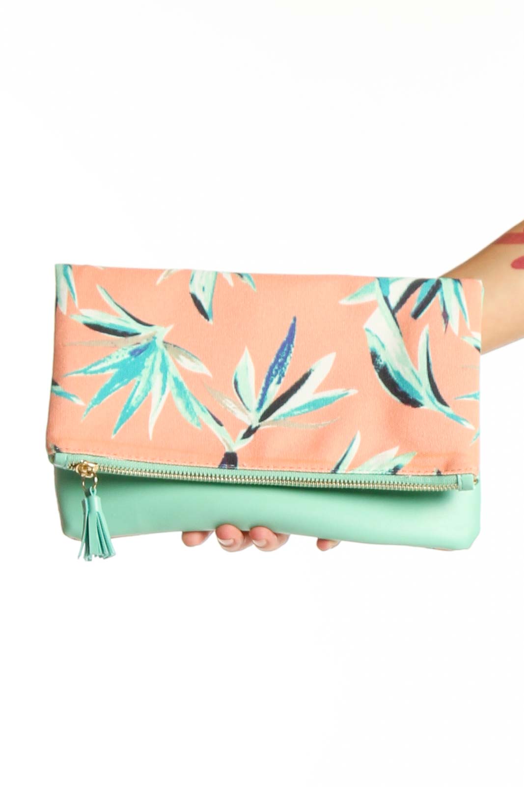 Front view of Rachel Pally peach floral print foldover clutch with mint green tassel