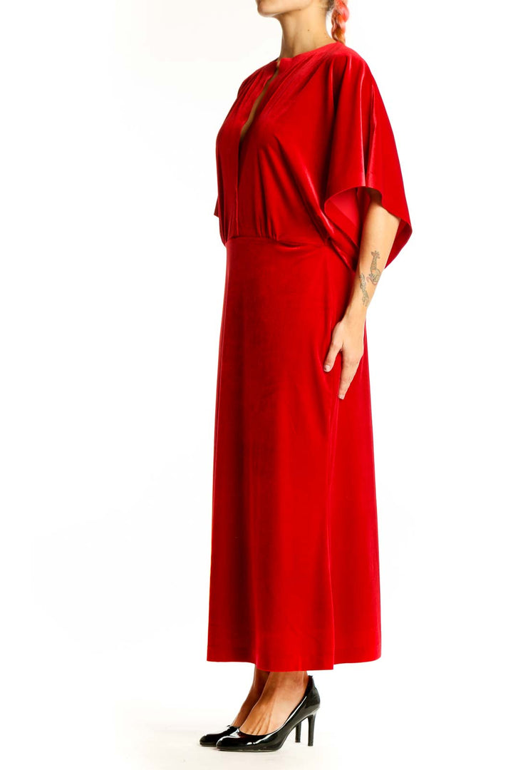 Front view of red velvet maxi dress with batwing sleeves by NORMA KAMALI
