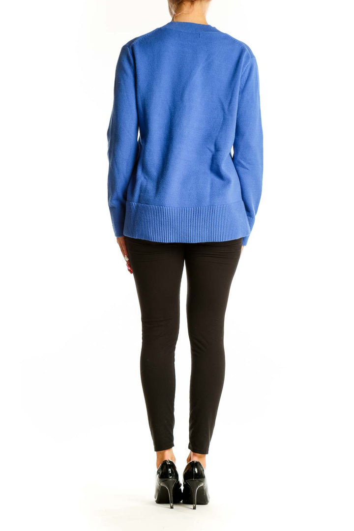 Side view of Banana Republic blue crewneck sweater on model with black pants