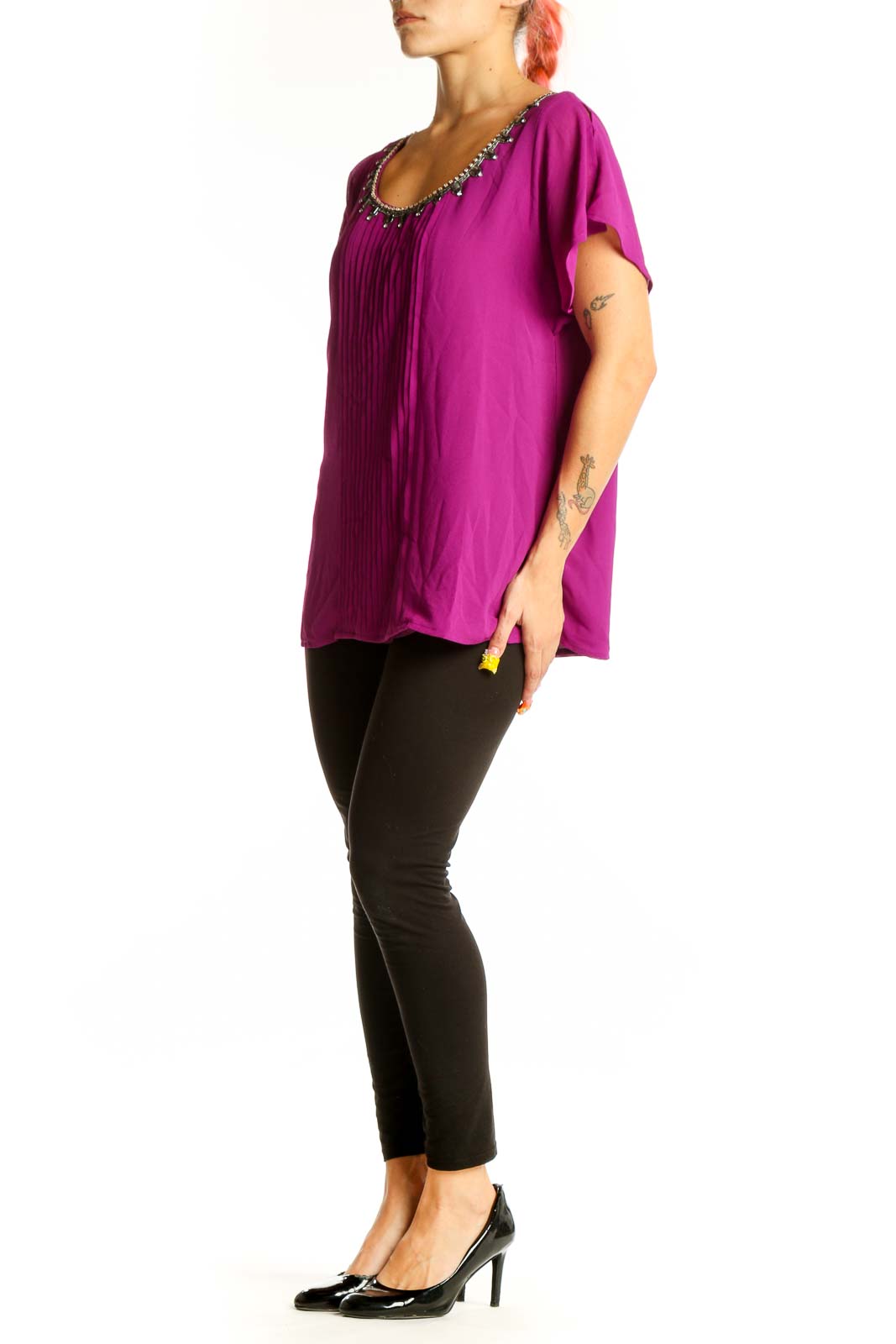 Front view of magenta pleated blouse with embellished neckline