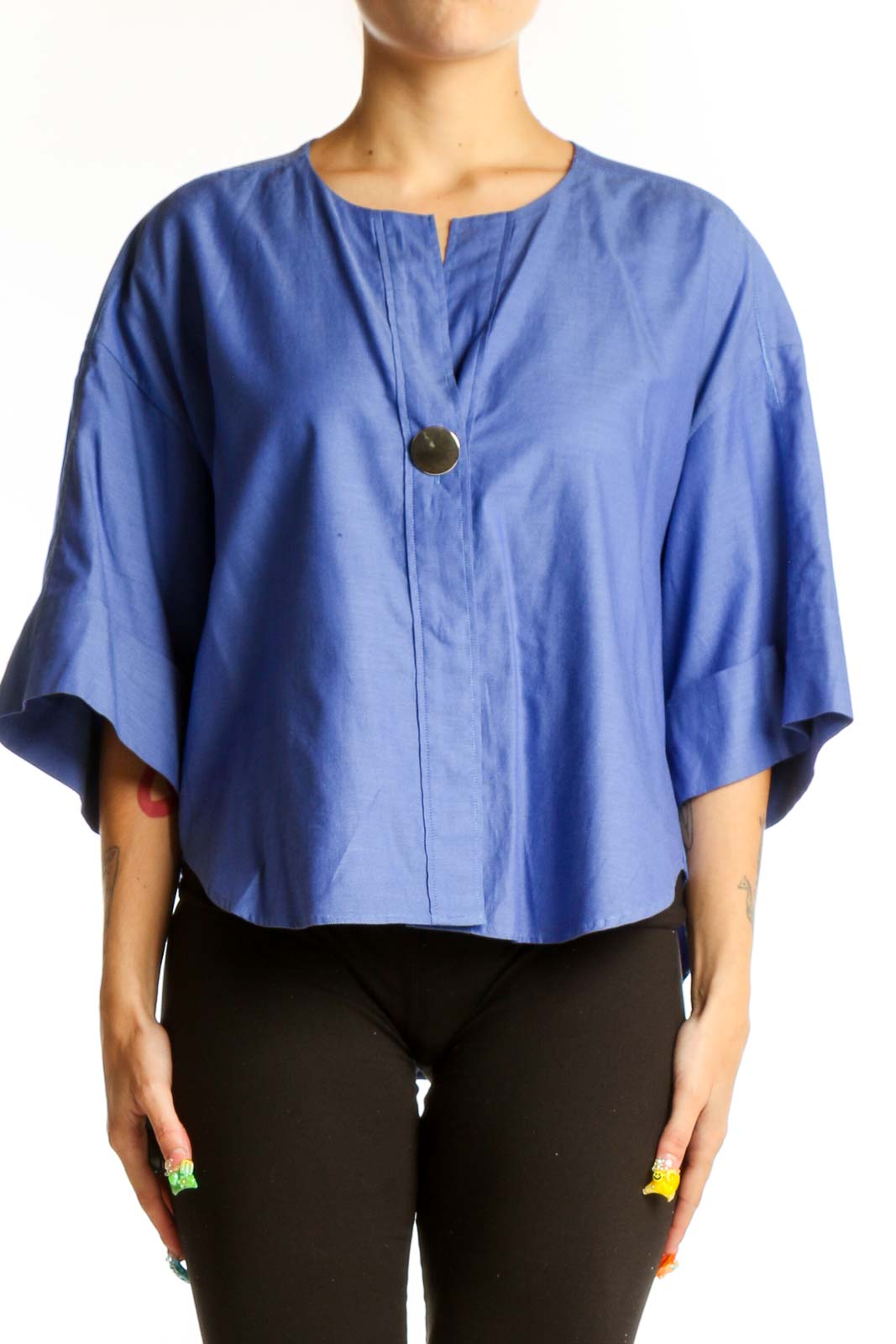 Front view of blue cotton kimono-style top with oversized sleeves and button closure