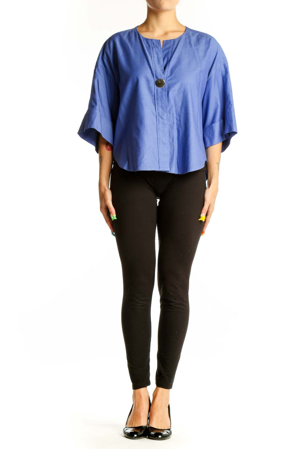 Front view of blue cotton kimono-style top with oversized sleeves and button closure