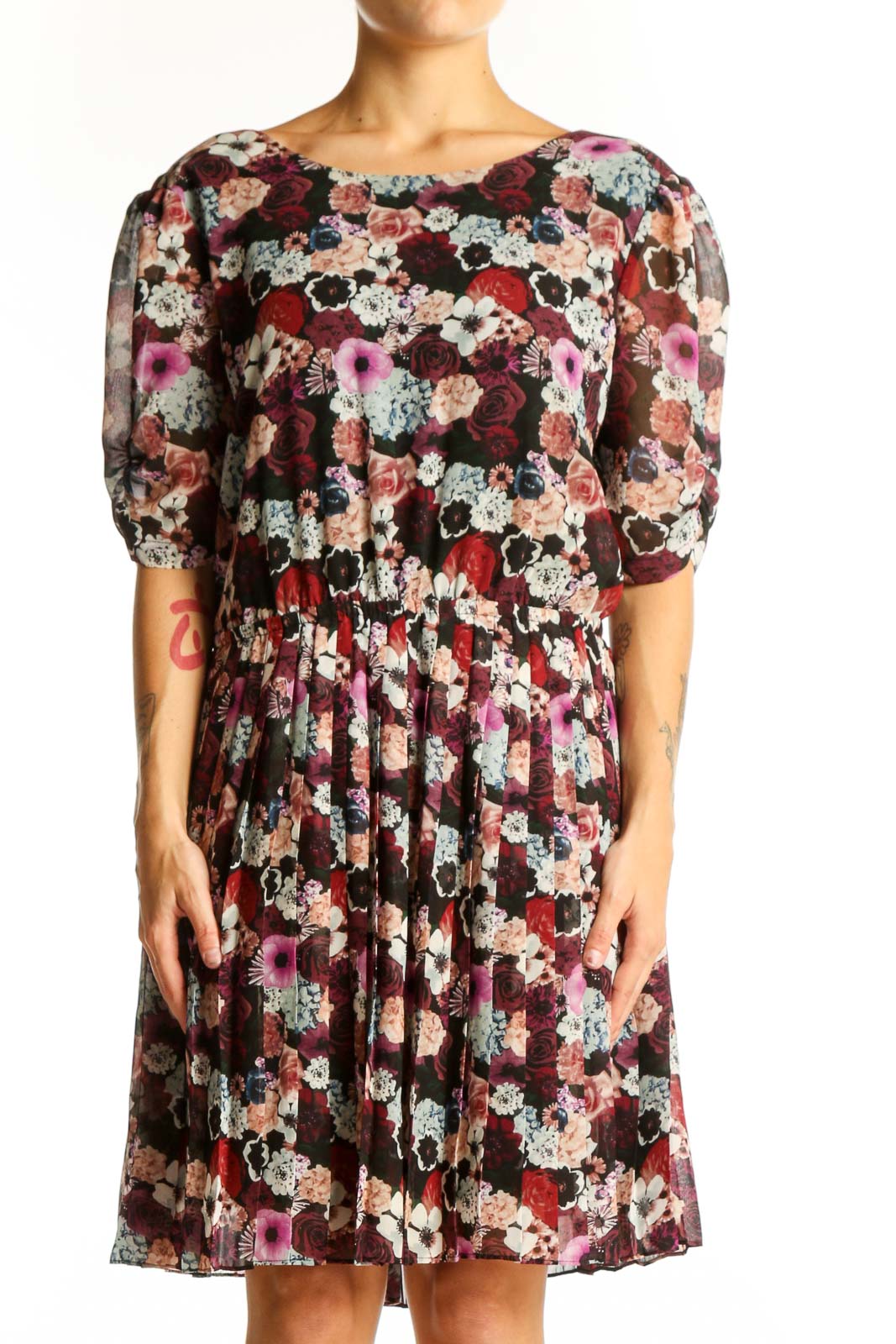 Front view of Pins and Needles burgundy floral puff sleeve dress with pleated skirt