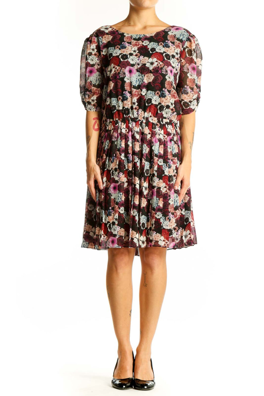 Front view of Pins and Needles burgundy floral puff sleeve dress with pleated skirt