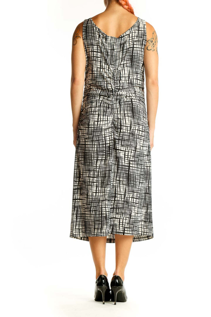 Side view of NORMA KAMALI Black and White Abstract Print Midi Dress