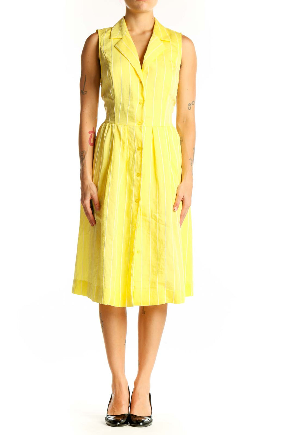 Front view of yellow striped sleeveless DKNY shirt dress with button-down front