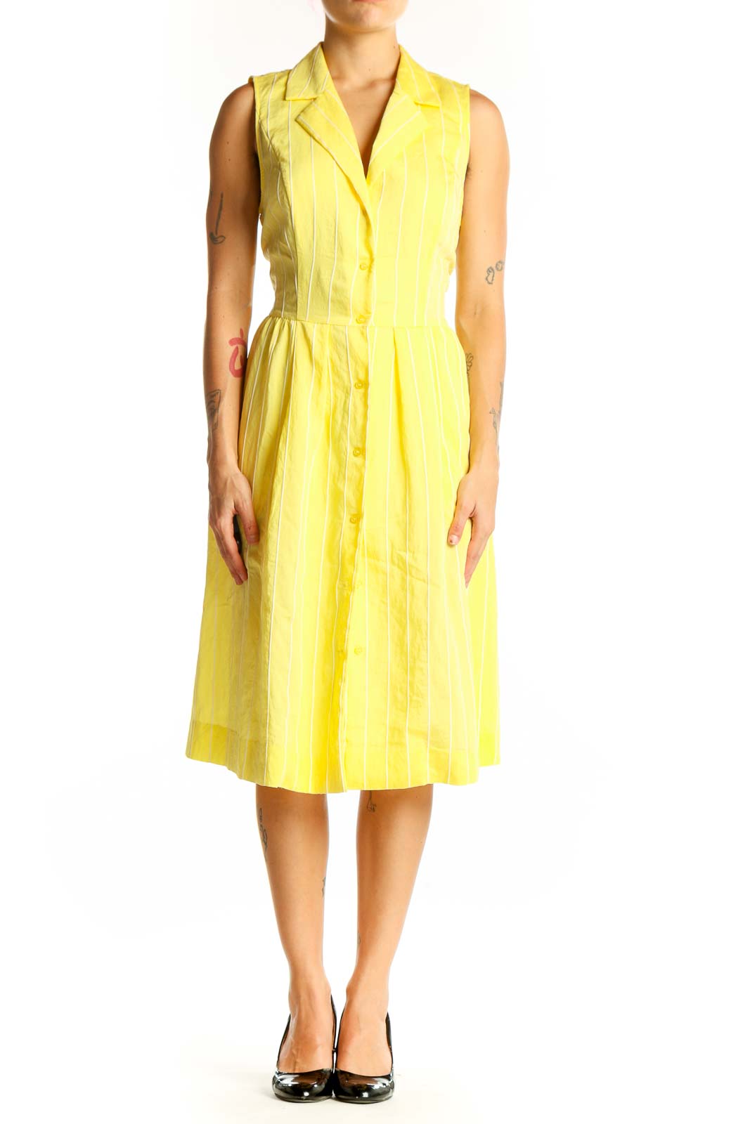 Front view of yellow striped sleeveless DKNY shirt dress with button-down front
