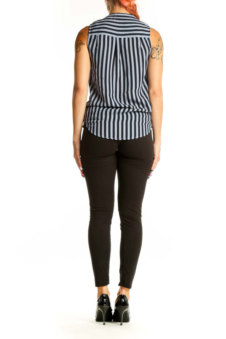 Side view of Blue and Black Striped Sleeveless Tie-Front Top from The Limited with black pants