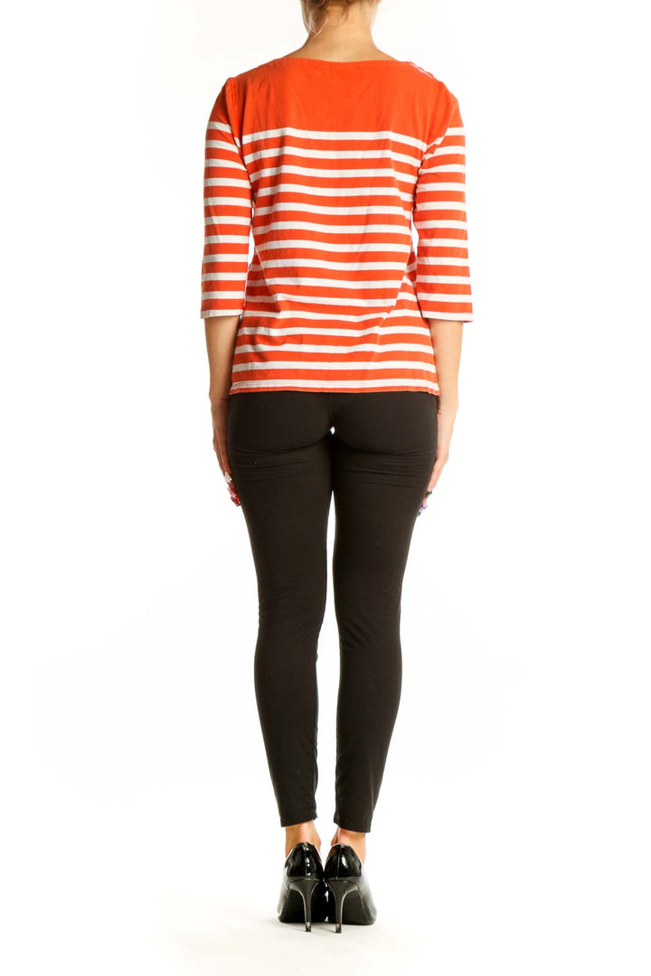 Back view of orange and white striped Maeve top showing full length