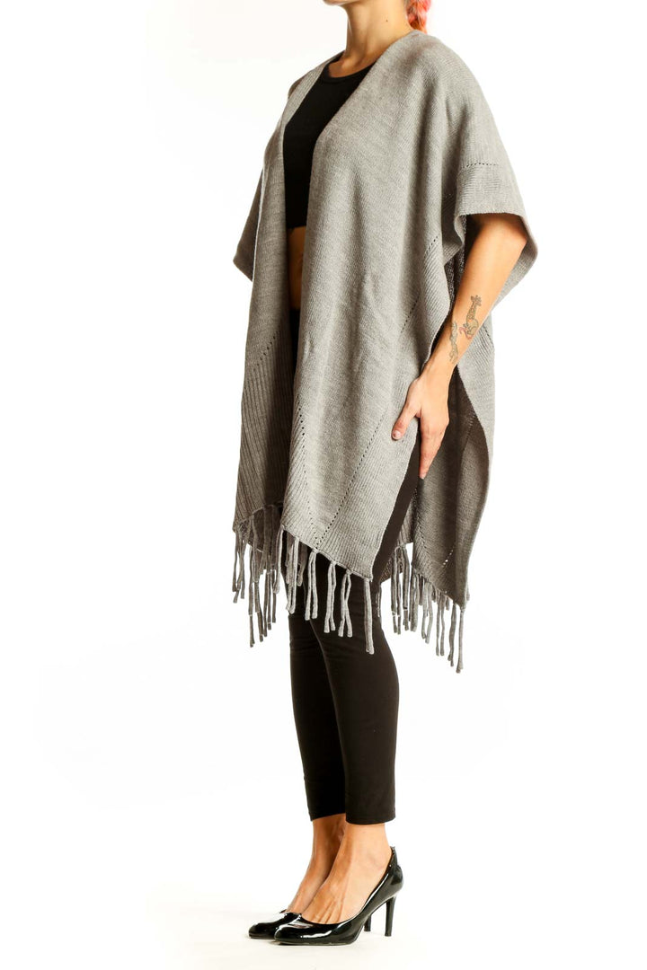 Front view of gray fringed acrylic knit poncho from Ann Taylor