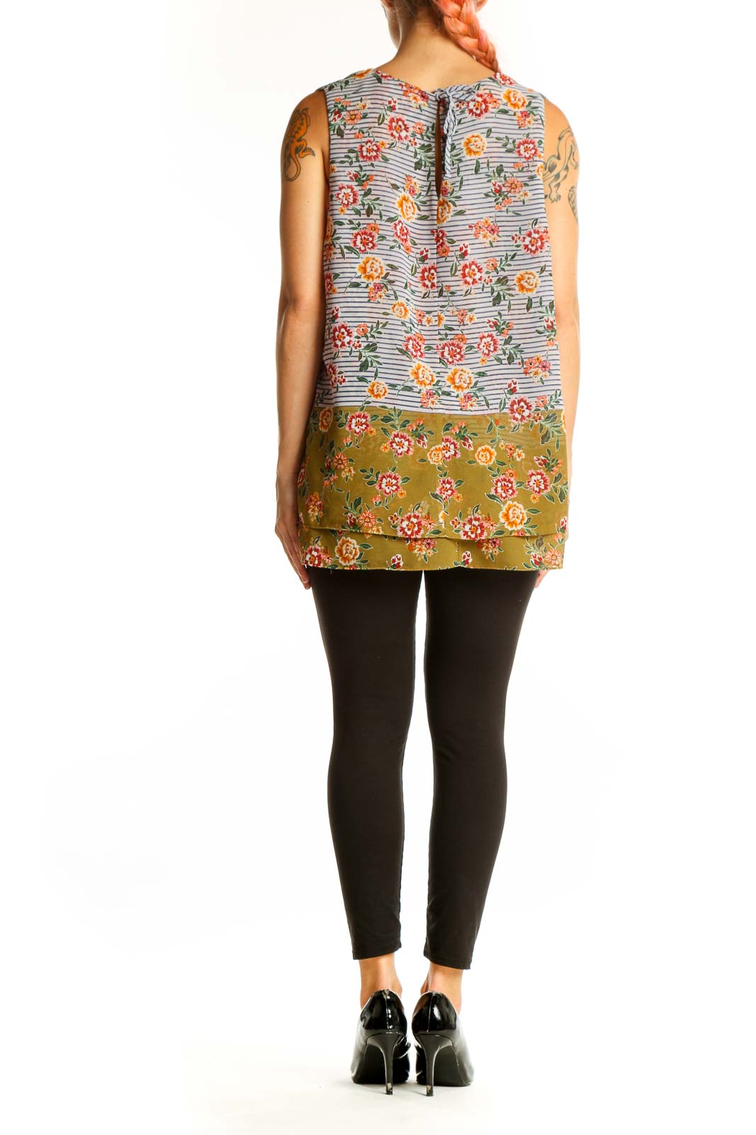 Side view of multicolor floral and striped sleeveless blouse by Cabi