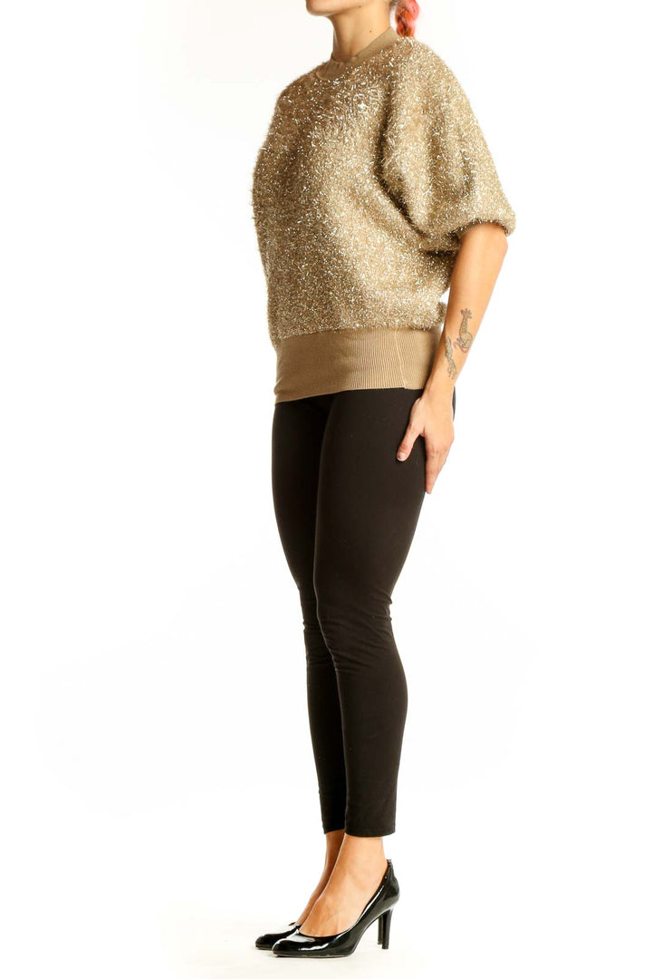 Front view of gold metallic puff-sleeve knit top by Maeve