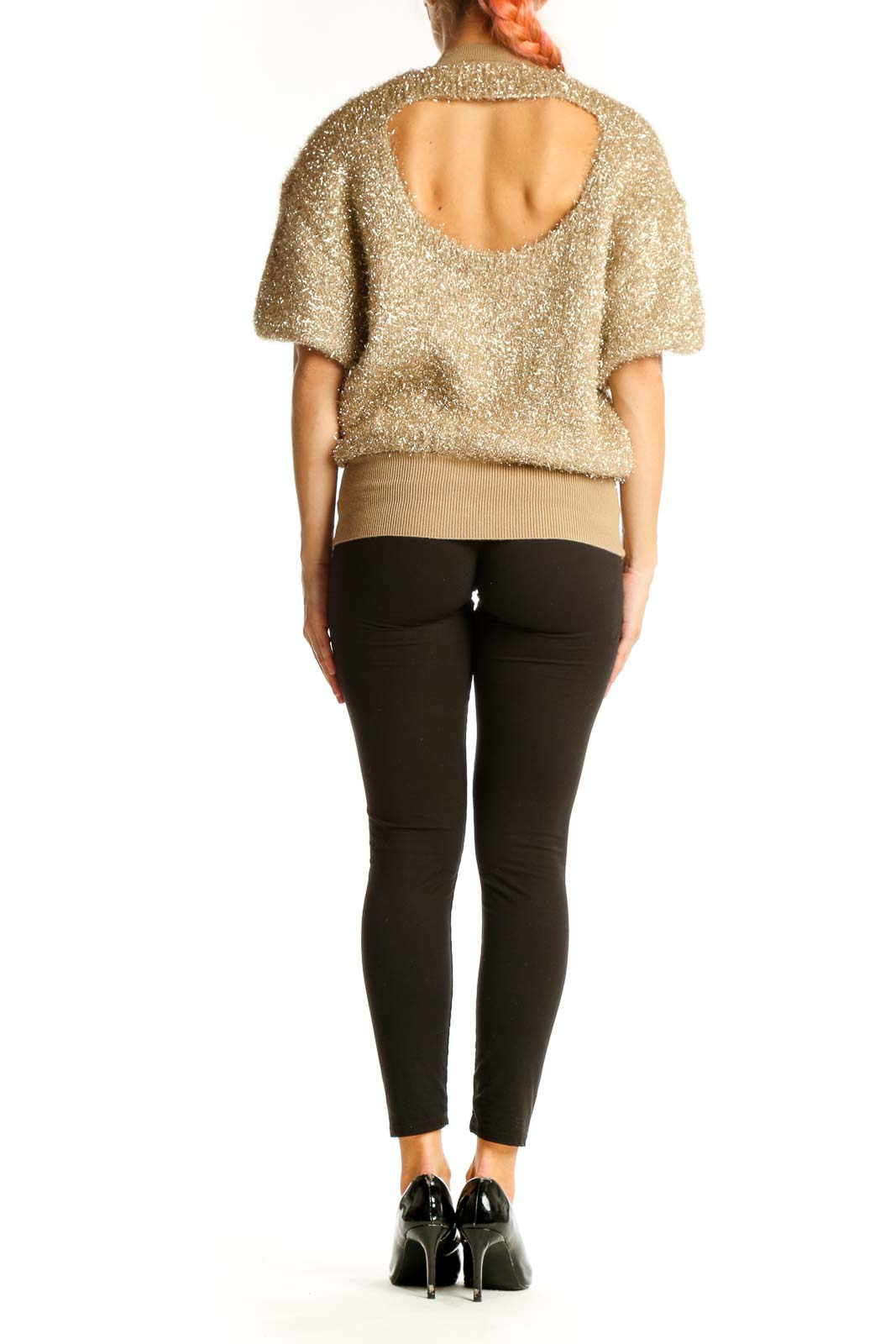 Side view of gold metallic puff-sleeve knit top by Maeve on model