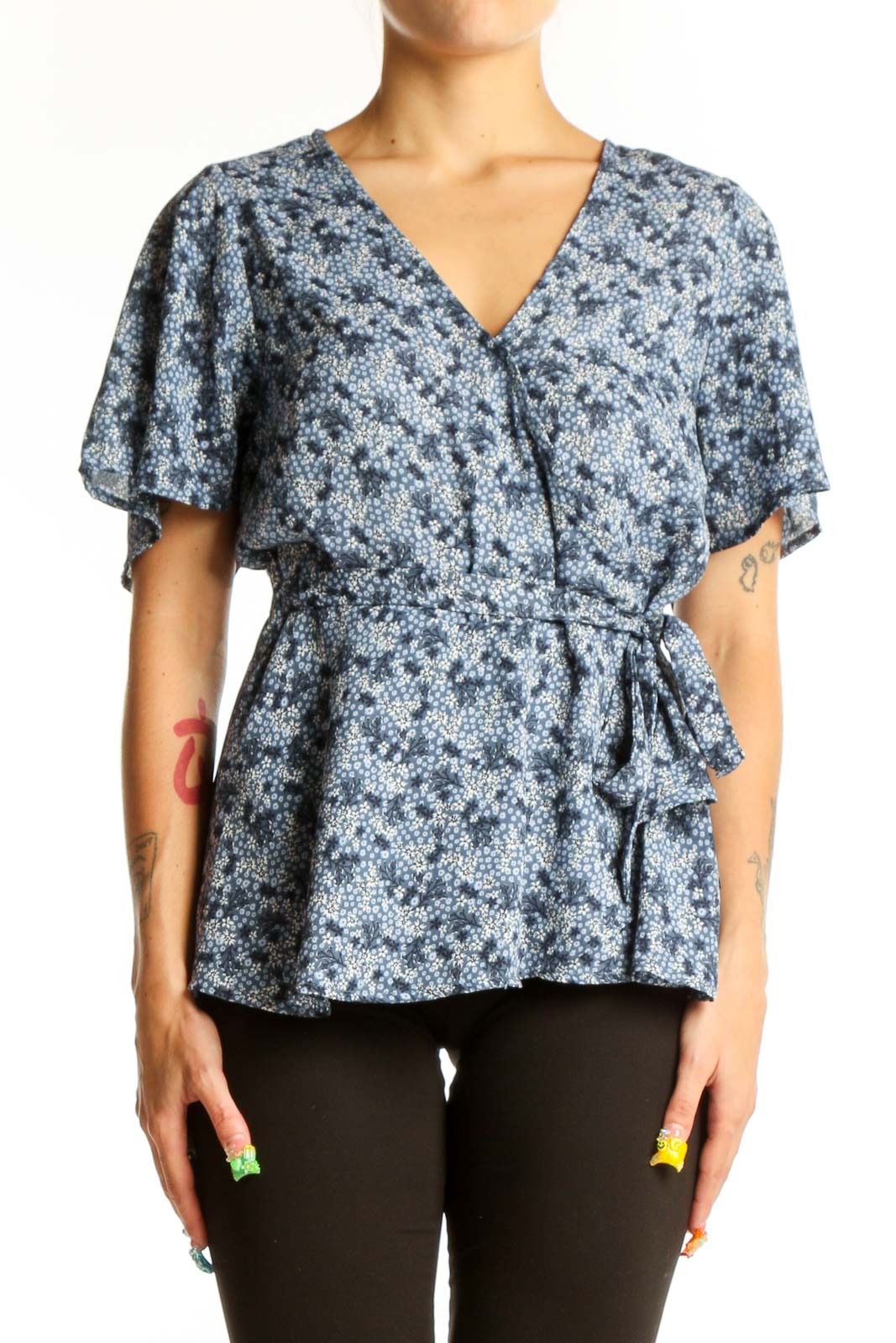 Front view of Bobeau blue floral wrap peplum top with short sleeves