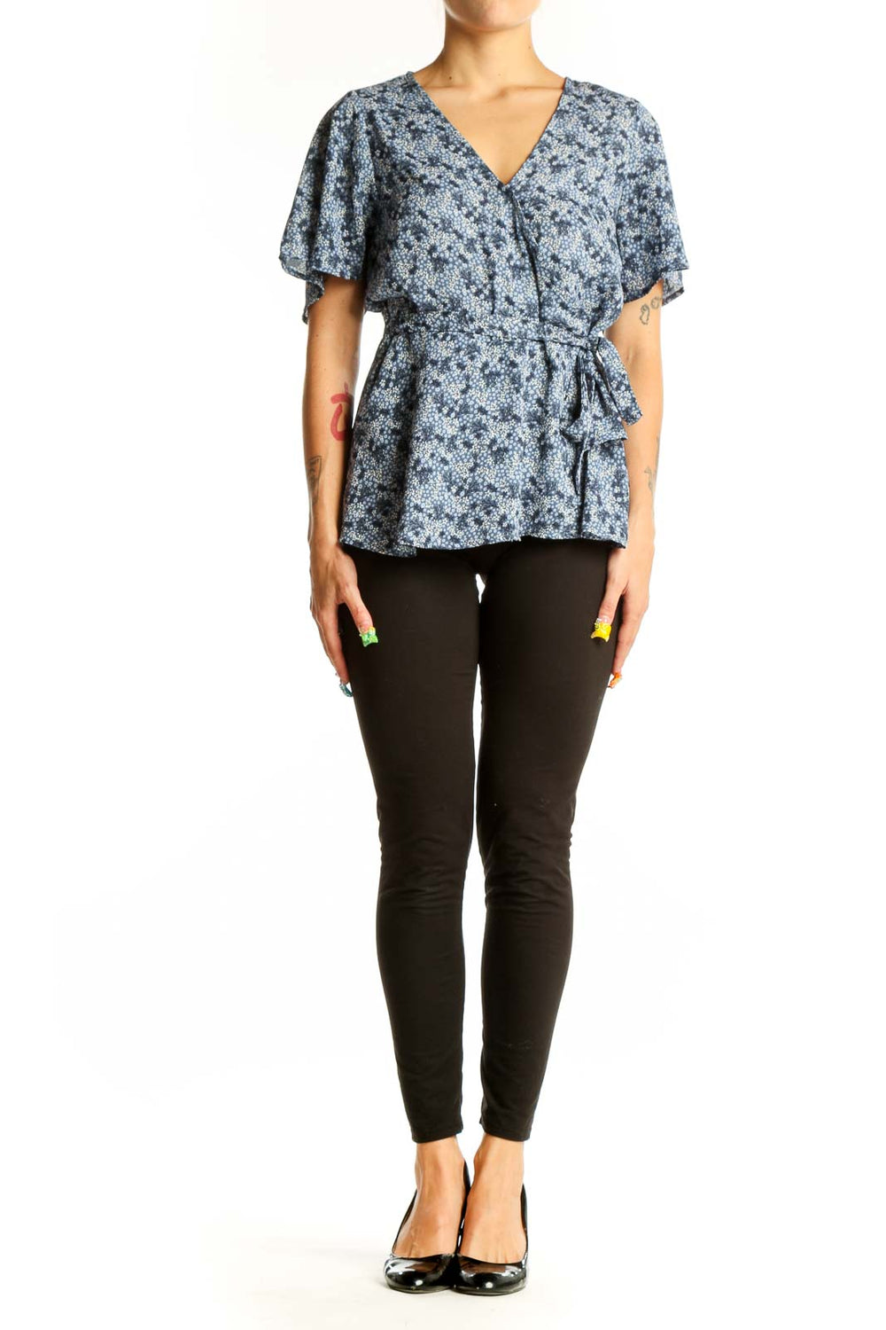 Front view of Bobeau blue floral wrap peplum top with short sleeves