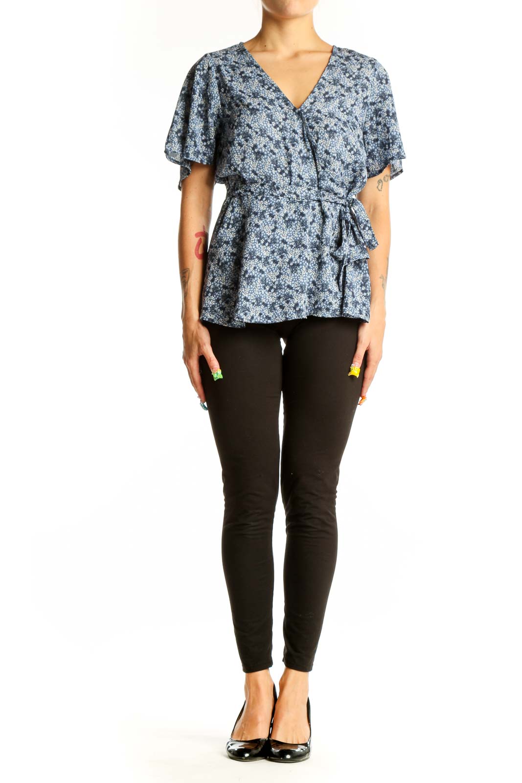 Front view of Bobeau blue floral wrap peplum top with short sleeves