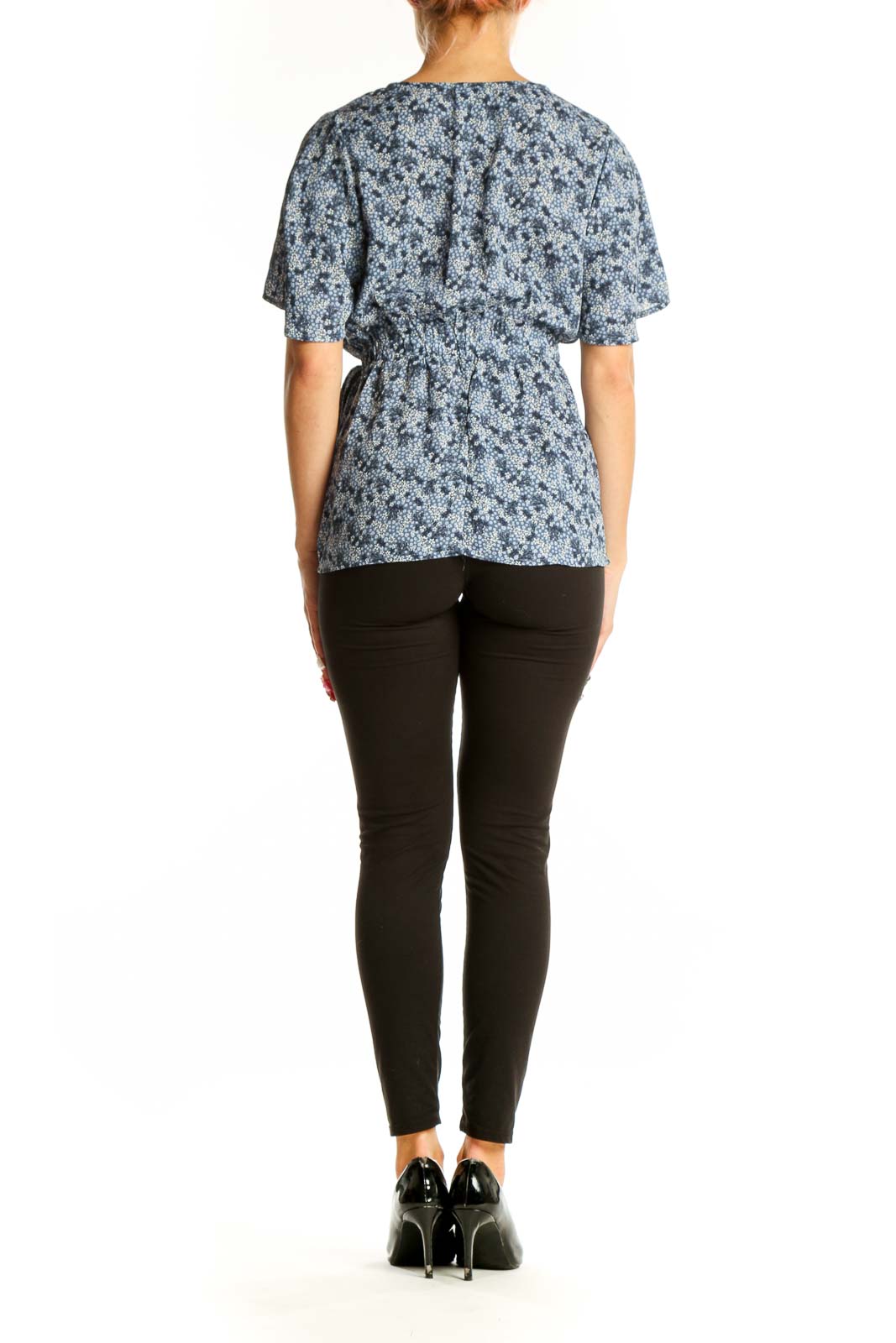 Side view of Bobeau blue floral wrap peplum top showing silhouette