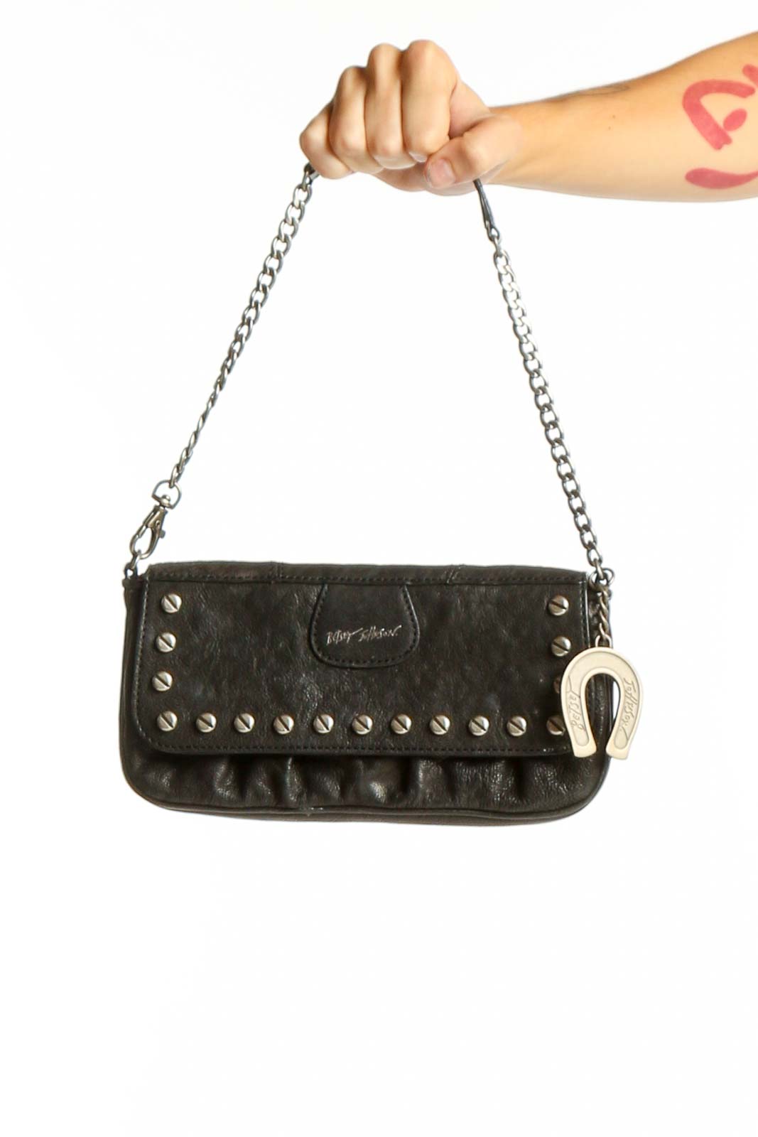 Front view of Betsey Johnson black studded clutch with chain strap