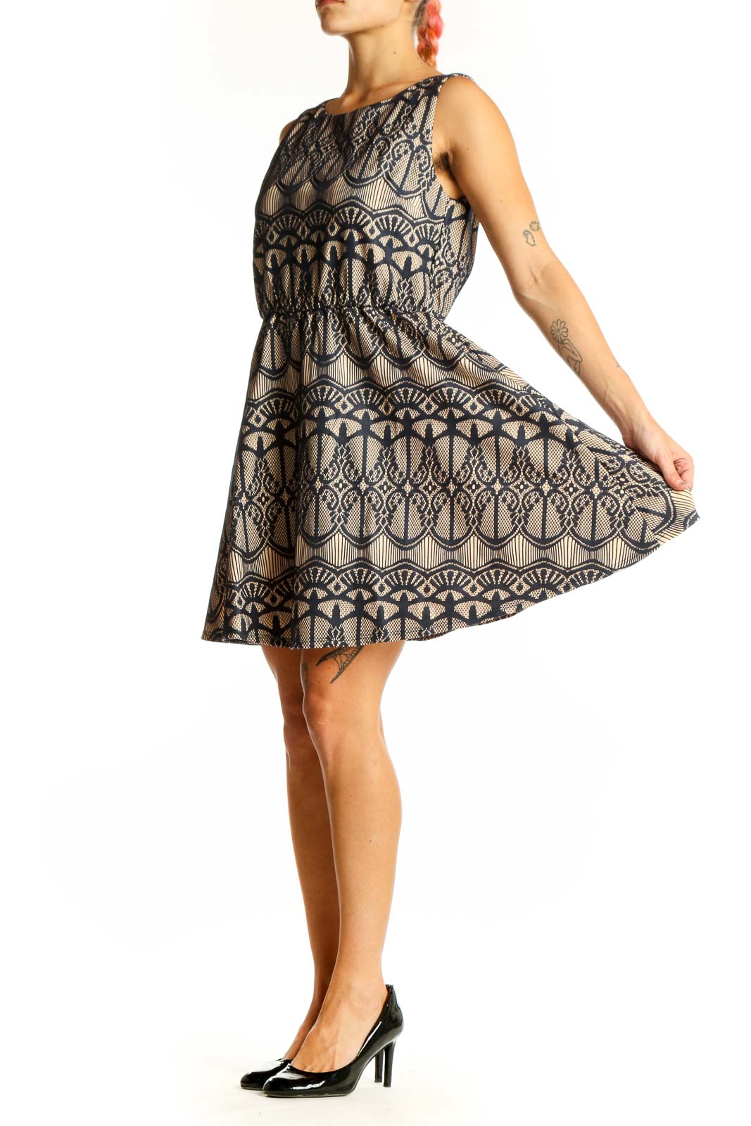 Front view of Want And Need beige sleeveless dress with navy lace pattern