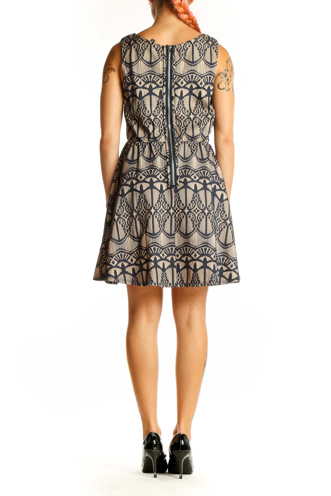 Side view of Want And Need beige sleeveless dress showing fit and flare silhouette