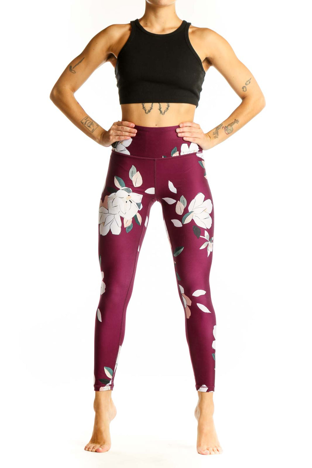 Front view of Athleta burgundy leggings with white floral print