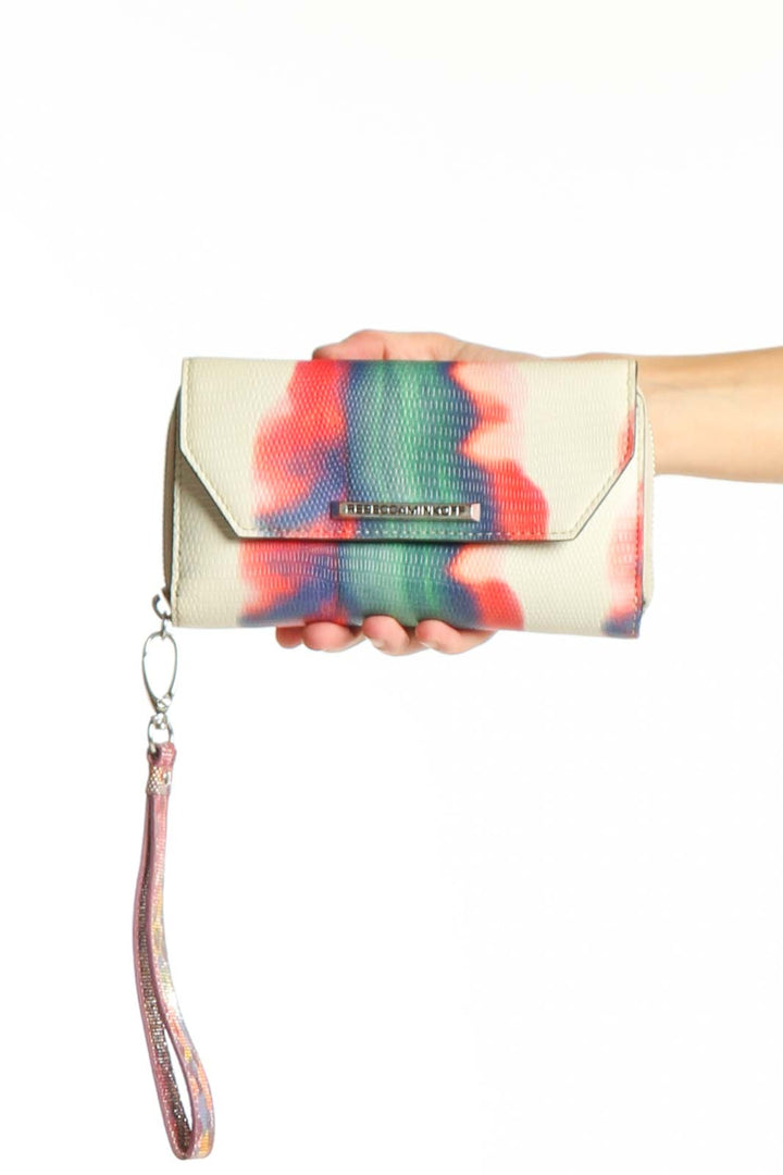 Front view of Rebecca Minkoff multicolor tie-dye envelope clutch with wrist strap