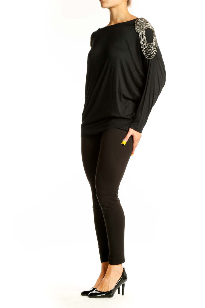 Front view of Unyx Black Dolman Top with silver beaded shoulder embellishments