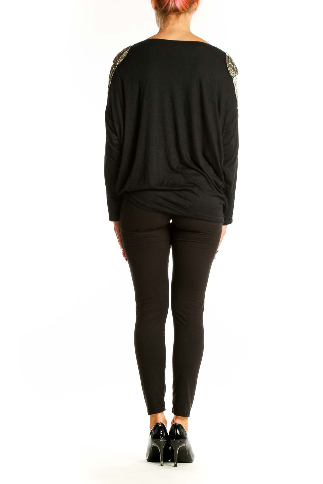 Side view of Unyx Black Dolman Top showing draped silhouette and embellished shoulder