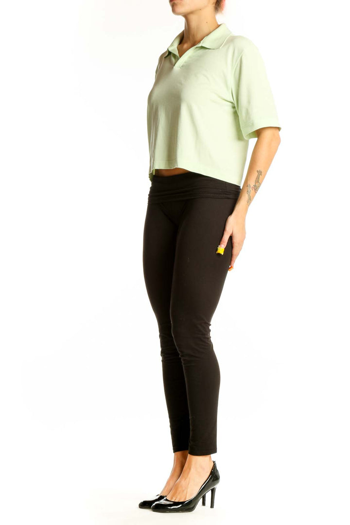 Front view of Lululemon mint green cropped polo top