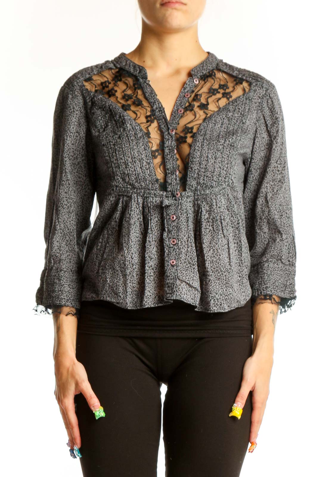 Front view of gray Free People peplum blouse with lace trim and button detail