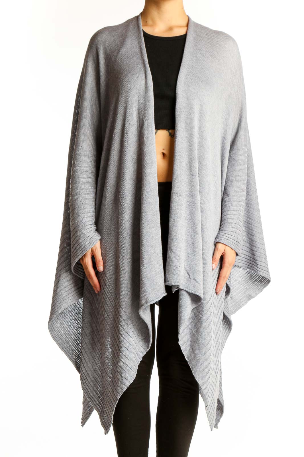 Front view of gray oversized knit poncho with ribbed edges