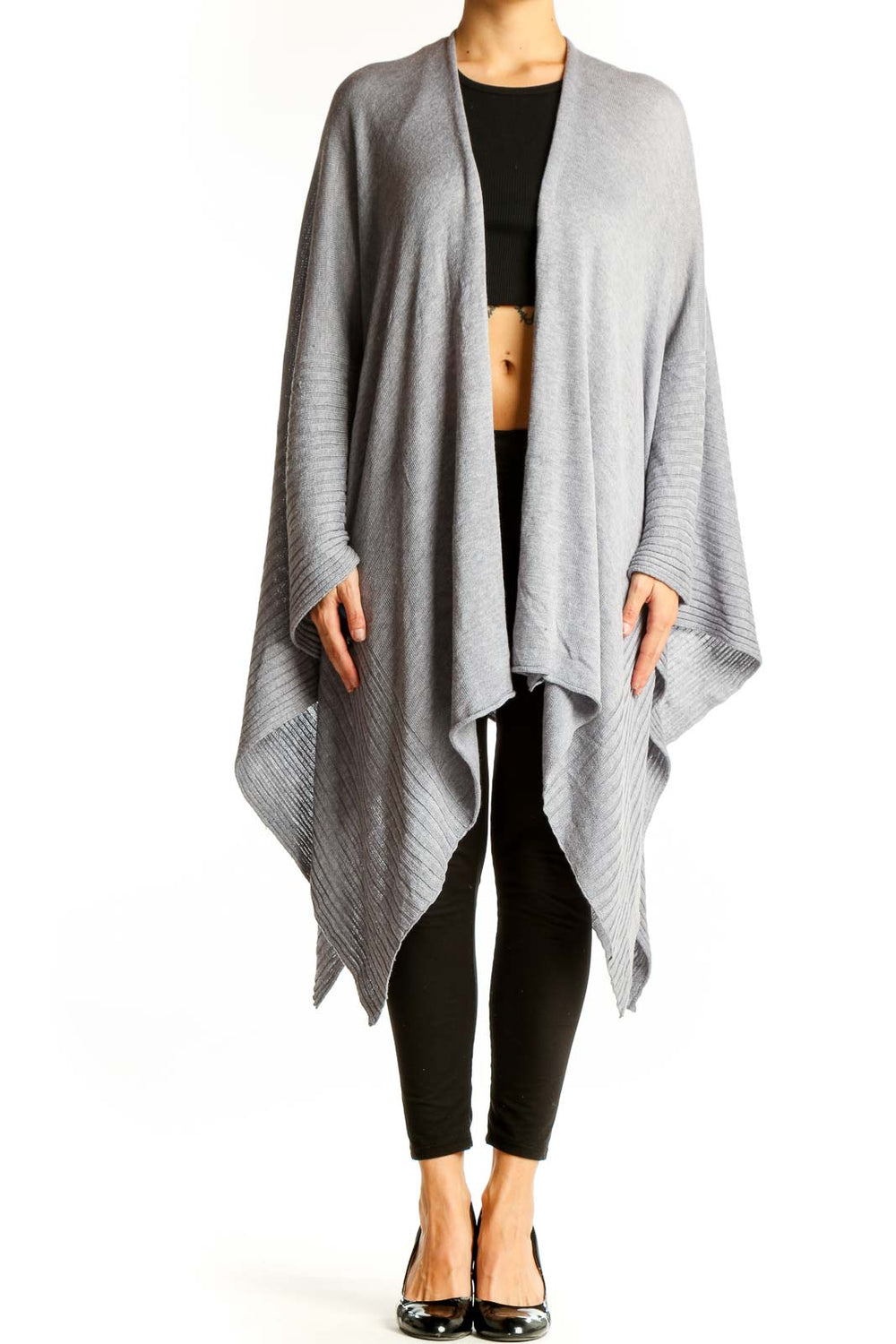 Front view of gray oversized knit poncho with ribbed edges