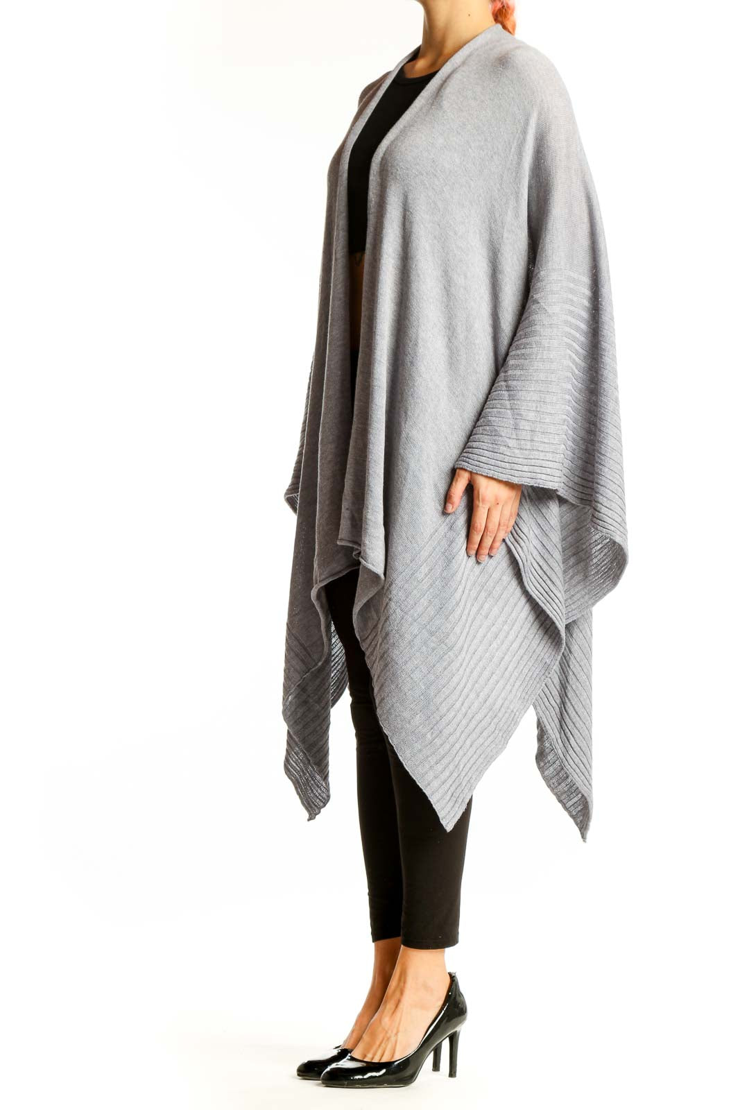 Front view of gray oversized knit poncho with ribbed edges