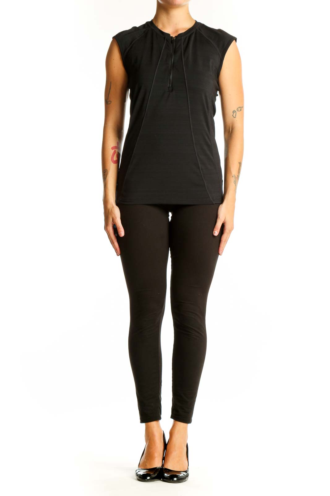Front view of black Athleta sleeveless athletic top with half-zip