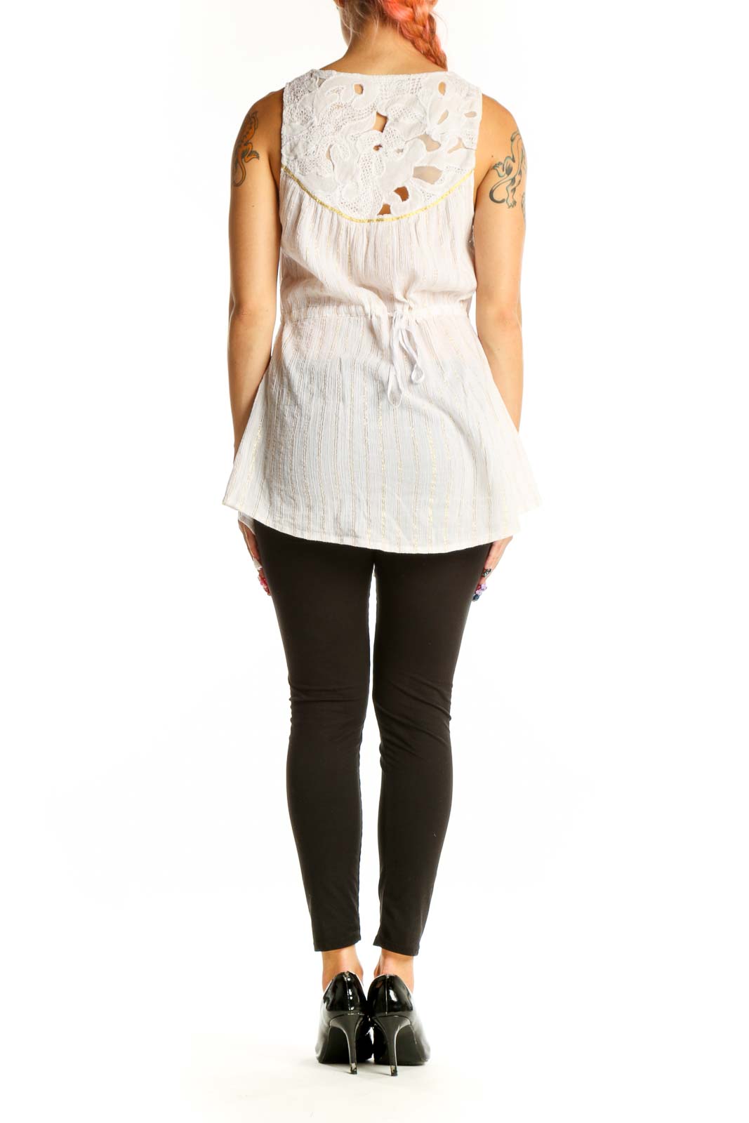 Side view of white sleeveless button-down top showing flowy silhouette