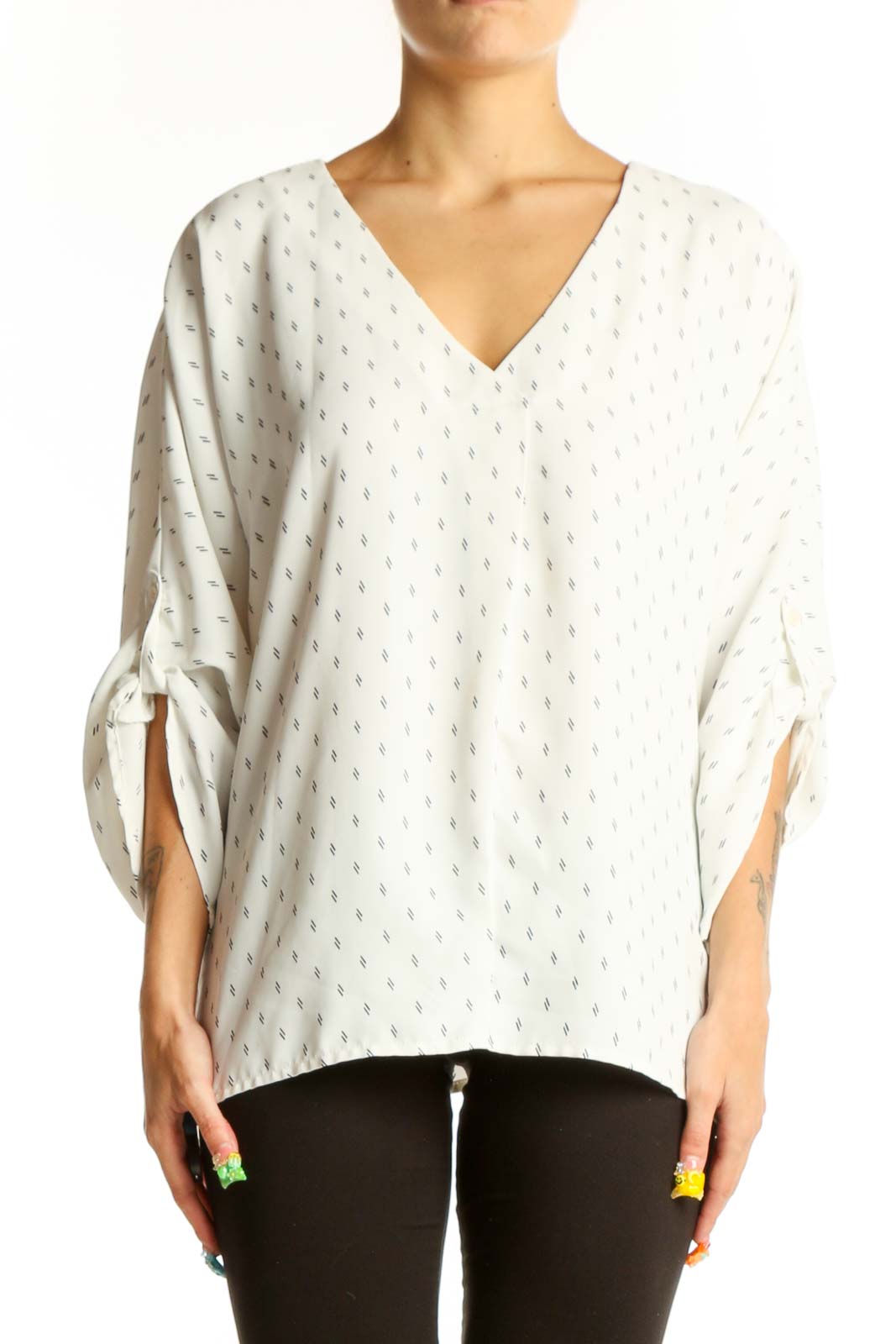 Front view of Vince Camuto white dotted V-neck blouse with tie sleeves