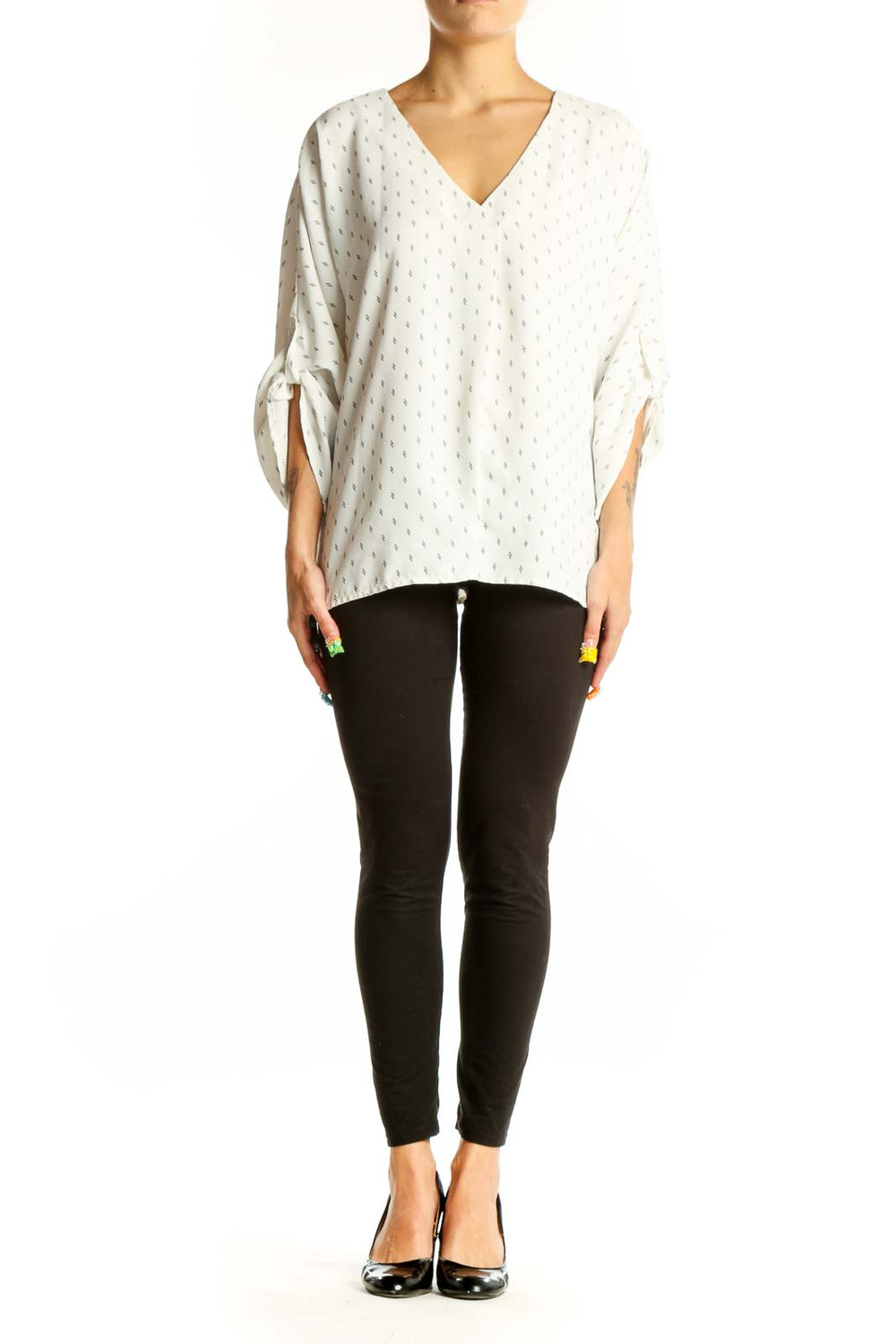 Front view of Vince Camuto white dotted V-neck blouse with tie sleeves