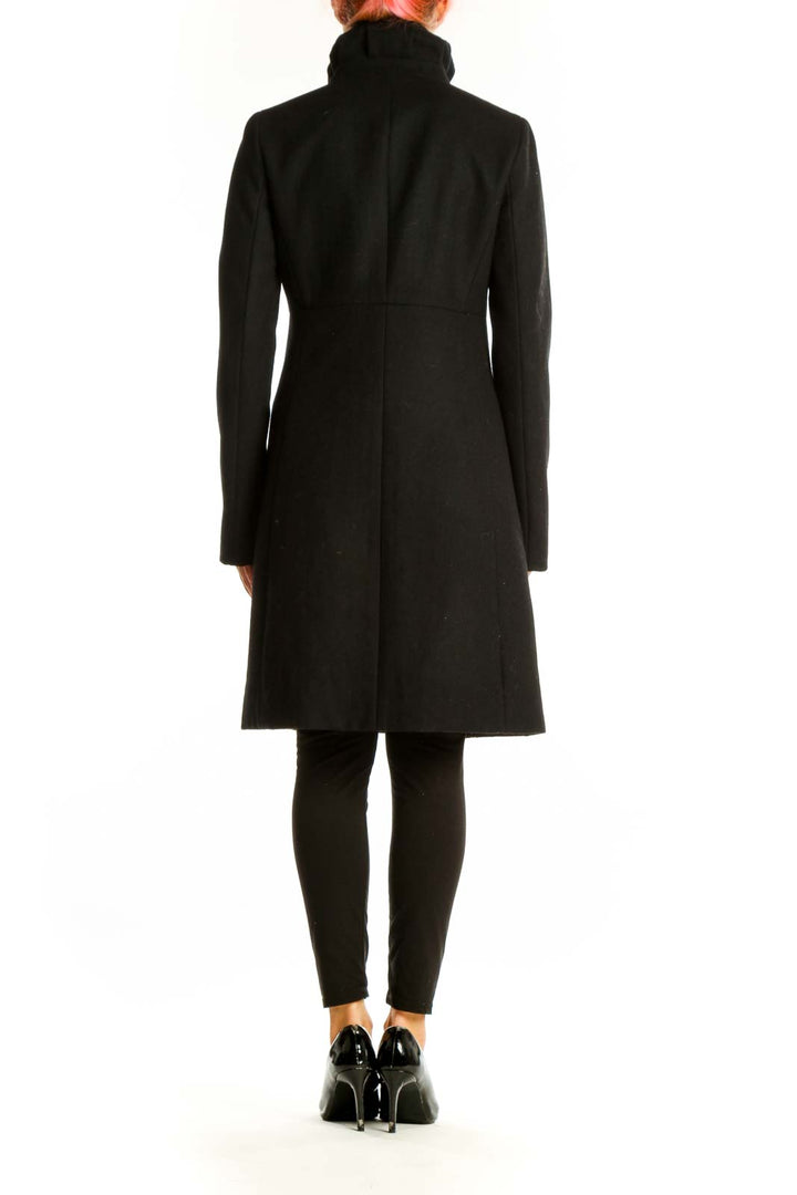 Side view of J.Crew black long coat showing length and fit
