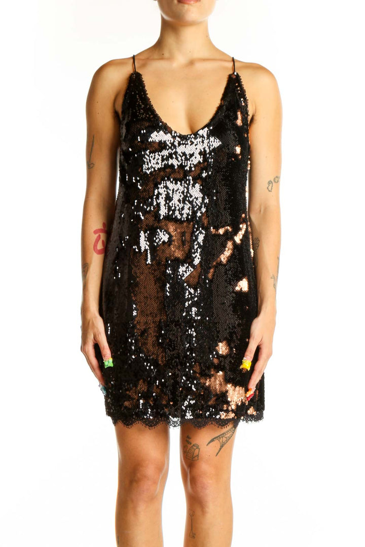 Front view of black sequin slip dress with lace trim by Intimately Free People