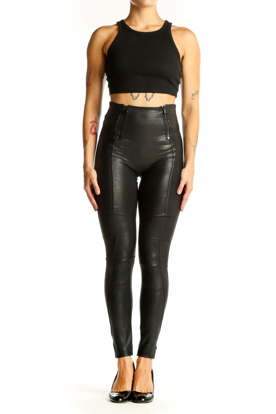 Front view of Spanx black high-waisted faux leather leggings with side zippers