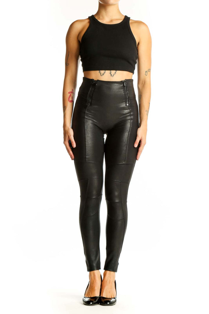 Front view of Spanx black high-waisted faux leather leggings with side zippers