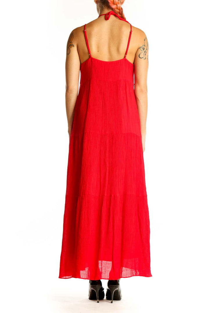 Side view of red halter maxi dress by Chelsea 28 showing flowy silhouette