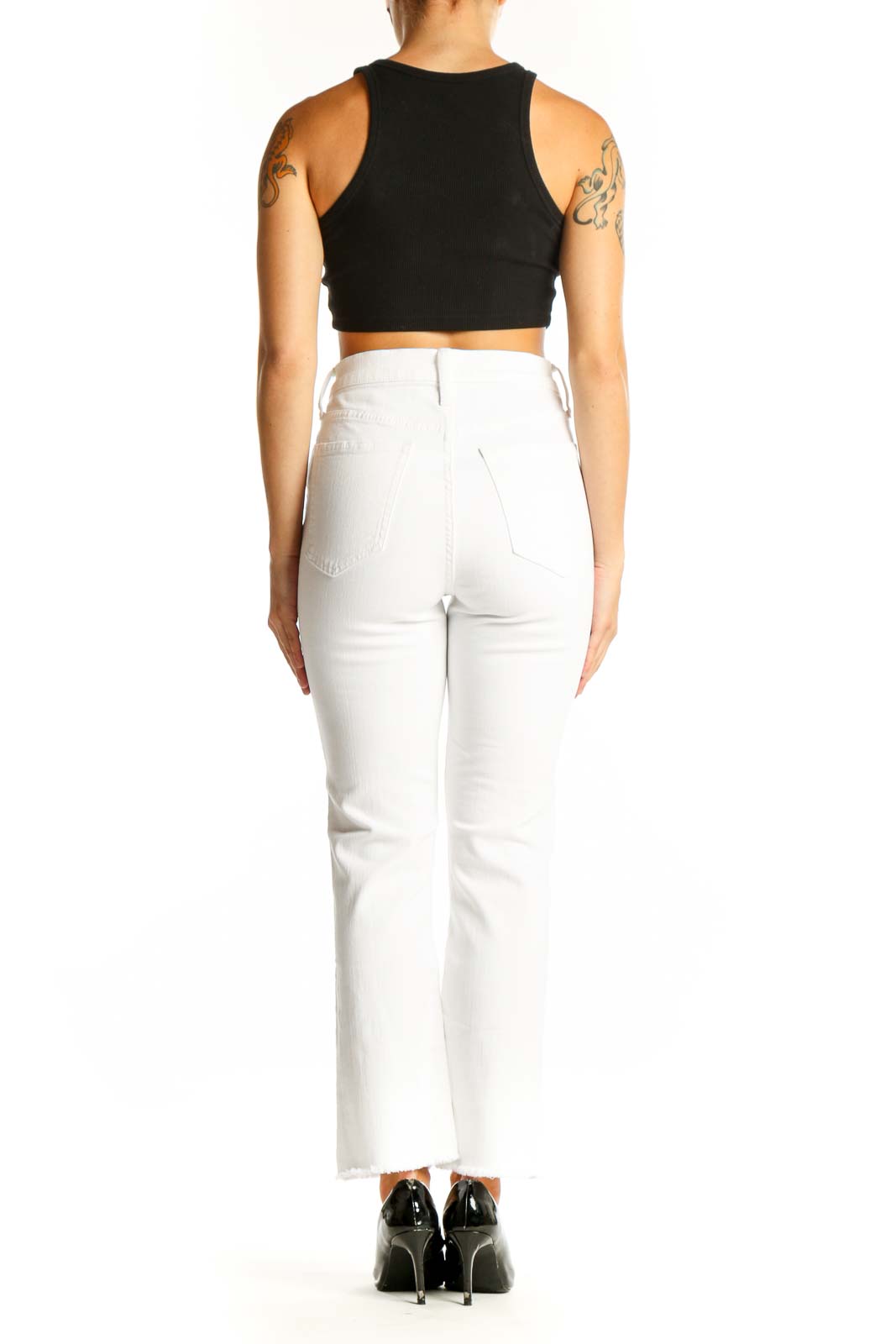 Side view of J.Crew white straight-leg jeans on model with black top