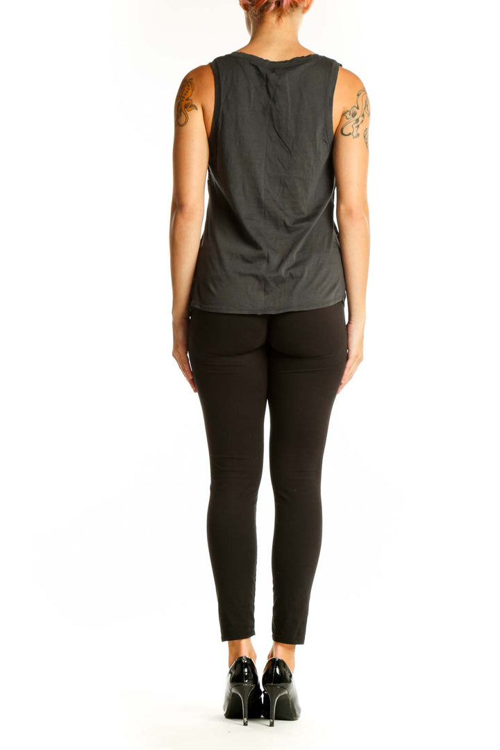 Side view of model wearing J.Crew black embellished cotton tank top with black pants