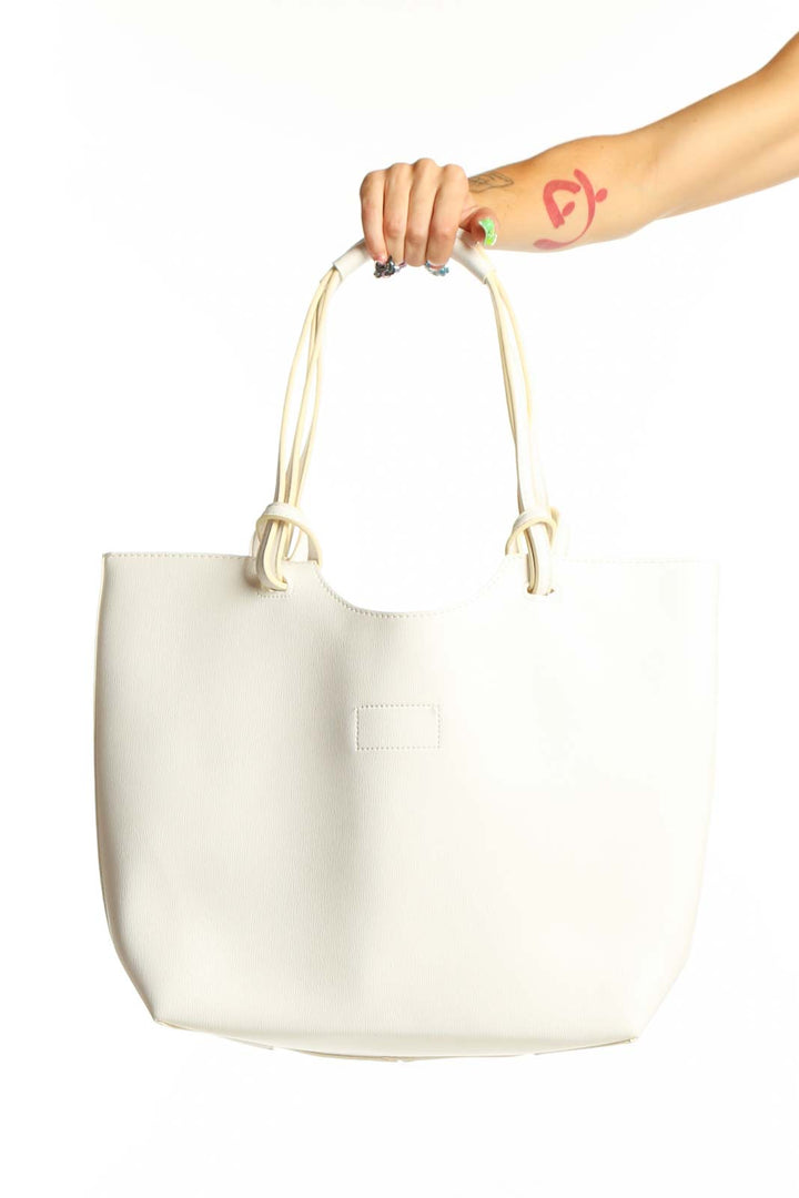 Front view of white leather Neiman Marcus tote bag with knotted handles